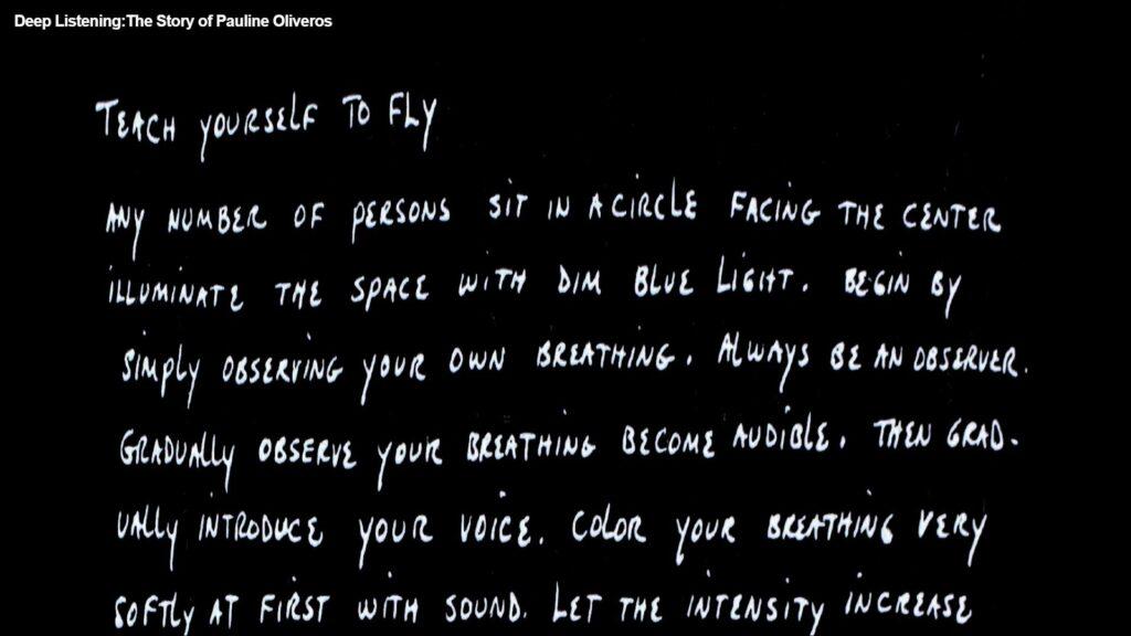 Weiße Handschrift auf schwarzem Grund. Da steht:
Teach yourself to fly
Any number of persons sit in a circle facing the center. Illuminate the space with dim blue light. Begin by simply observing your own breathing. Always be an observer. Gradually observe your breathing become audible. Then gradually introduce your voice. Color your breathing very softly at first with sound. Let the intensity increase